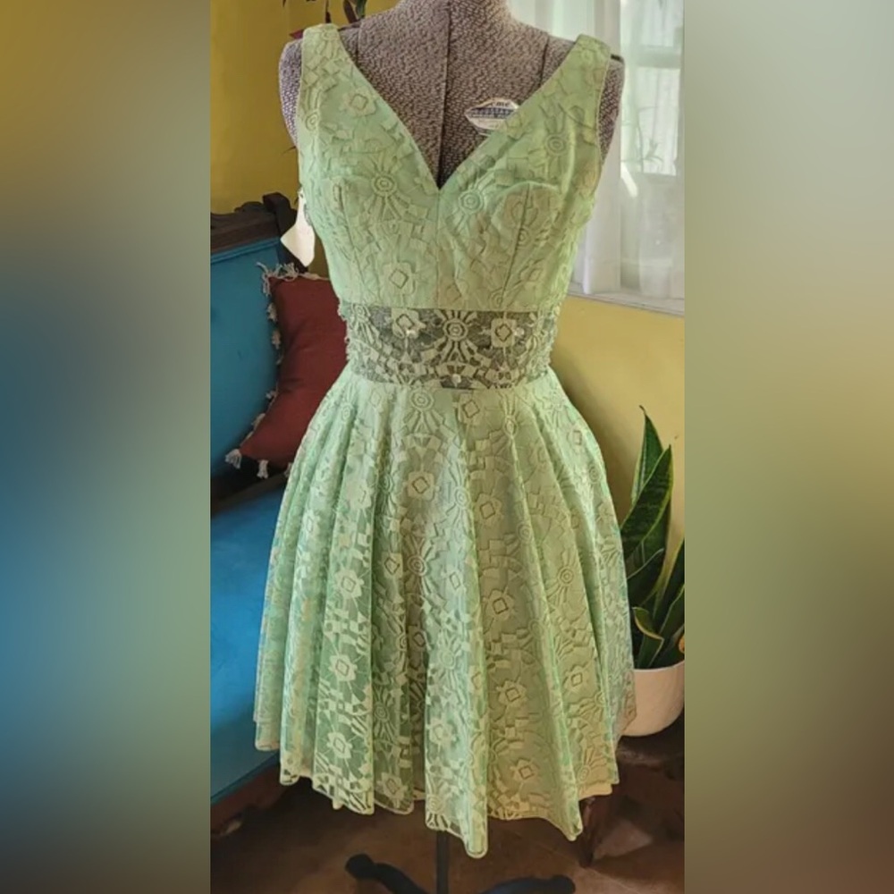 Vintage 1960s, 
House of NuMode cocktail dress sheer beaded midriff.
US 4.